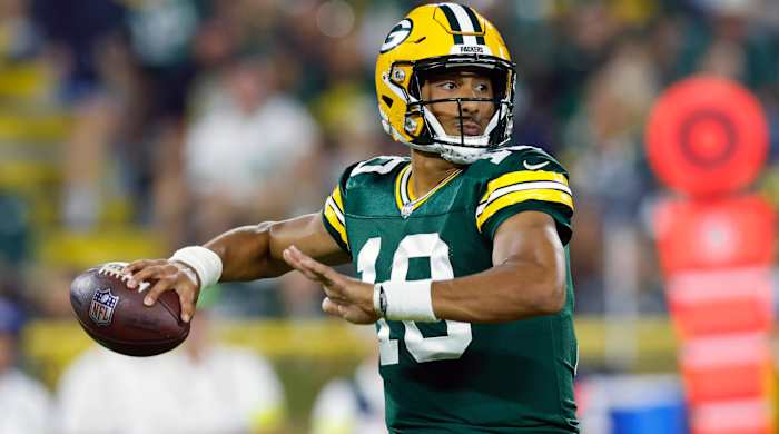 Green Bay Packers quarterback Jordan Love throws a football